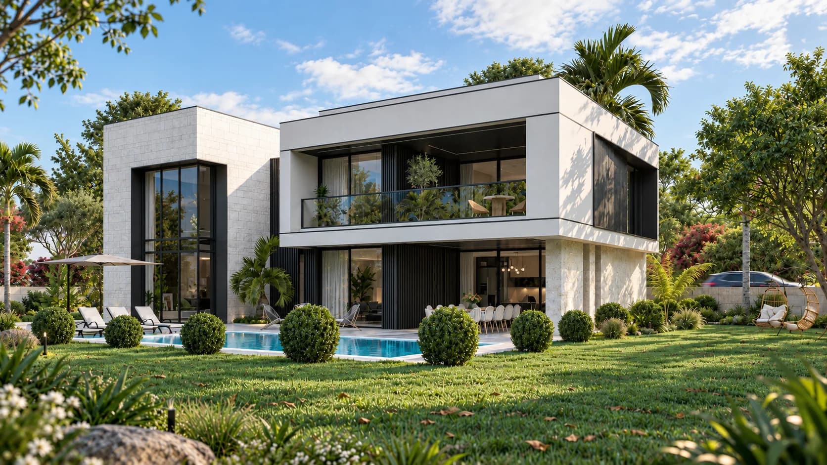 Anahtar teslim inşaatla tamamlanmış, taş kaplamalı ve geniş camlı iki katlı villa; önde havuz ve bahçe